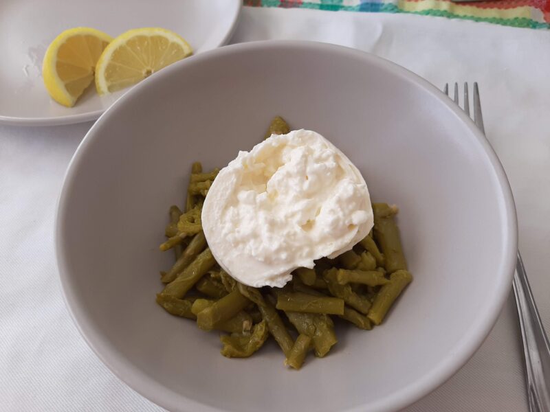 plated lemon garlic asparagus with burrata on top